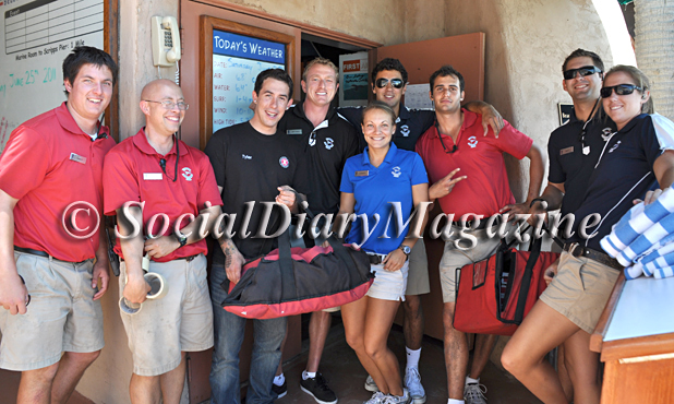 beach crew members at the La Jolla Beach & Tennis Club  receiving Extreme Pizzas as a thank you from Social Diary Magazine